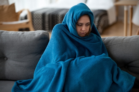 woman feeling cold at home